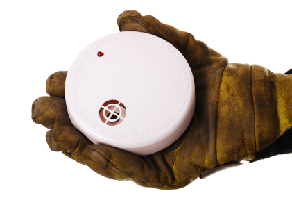 fireman holding smoke detector